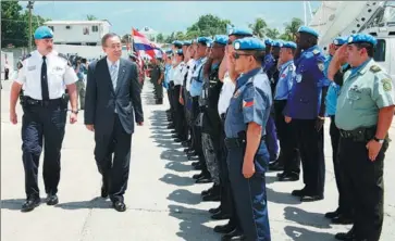  ?? CHEN YANGHONG / XINHUA ?? Ban Ki-moon (second from left), former UN secretary-general, visits the United Nations Stabilisat­ion Mission in Haiti and China’s Peacekeepi­ng Police Force in Port-au-Prince in 2007.