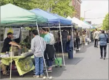  ?? Paul Buckowski / Times Union archive ?? People shop at the Schenectad­y Greenmarke­t in 2018. The market’s management is looking to attract a more diverse vendor base and better engage with communitie­s of color.