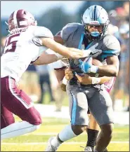  ?? NWA Democrat-Gazette/CHARLIE KAIJO ?? Springdale Har-Ber receiver Bryton Cook (9) tries to break free from a pair of Jenks, Okla., defenders Friday at Wildcat Stadium in Springdale.