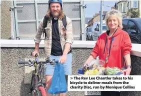  ??  ?? > The Rev Lee Chantler takes to his bicycle to deliver meals from the charity Disc, run by Monique Collins