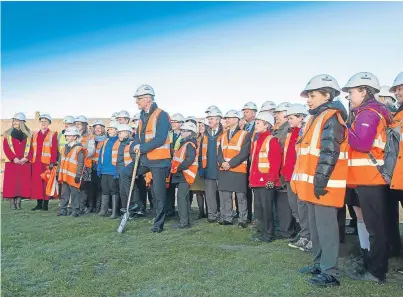  ?? Pictures: Angus Findlay ?? Education Secretary John Swinney cuts the first turf at the site of the new school.
