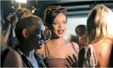  ??  ?? Rihanna unveiled her Savage X Fenty lingerie line to close out NYFW; Bella Hadid (right) dazzles in a white blazer and matching shorts at the Michael Kors show