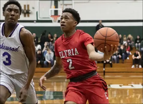  ?? JENNIFER FORBUS — FOR THE MORNING JOURNAL ?? Elyria’s MarSaun Robinson drives against Lakewood on March 5 at Elyria Catholic.