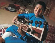  ?? GAVIN YOUNG ?? Ayush Ghosh is the world’s youngest profession­al classical sitar player and is also heavily interested in robotics.