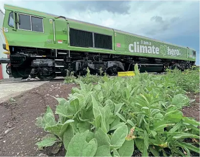  ?? DfT/DB Cargo ?? Pictured shortly before it was officially unveiled in its new green ‘climate hero' livery at the end of July, No. 66004 quickly attracted photograph­er interest on the main line.