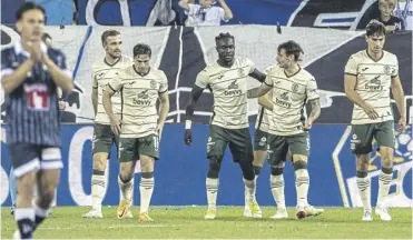  ?? ?? Elie Youan, centre, is congratula­ted after scoring Hibs’ opener against Luzern in Switzerlan­d