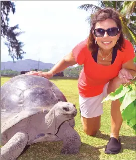  ?? Photo by Steve MacNaull ?? Tyson, the 120-year-old tortoise, hangs out with Kerry MacNaull on Curieuse island in the Seychelles.