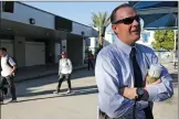  ?? Katharine Lotze/The Signal ?? New Saugus High School Principal Vince Ferry stands on campus as students make their way to class on the Hart District’s first day of classes for the 2017-2018 school year on Thursday.