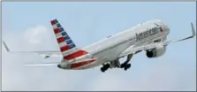  ?? THE ASSOCIATED PRESS ?? An American Airlines passenger jet takes off from Miami Internatio­nal Airport in Miami.
