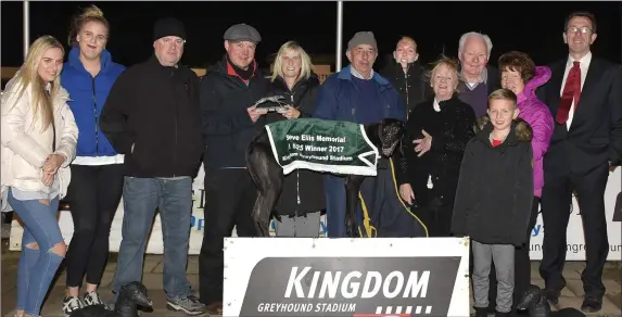  ??  ?? Natalie Smith presents the winners’ trophy to Berkie Browne on behalf of the owner after Saleen Brax won the Steve Ellis Memorial Stakes Final at the Kingdom Greyhound Stadium on Friday night. Included, from left, are Grace and Molly Smith, Mike...