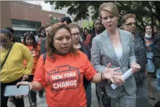  ?? MARY ALTAFFER — THE ASSOCIATED PRESS ?? Democratic candidate for governor Cynthia Nixon talks to a community activists after a campaign event at Borough of Manhattan Community College, Wednesday in New York.