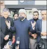  ??  ?? UNITED IN FAITH: Religious leaders hold hands in a display of unity in Manchester.