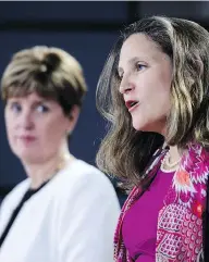  ?? SEAN KILPATRICK / THE CANADIAN PRESS ?? Foreign Affairs Minister Chrystia Freeland, flanked by Internatio­nal Developmen­t Minister Marie-claude Bibeau, promised that Canada would support efforts to hold ethnic cleansers in Myanmar to account.