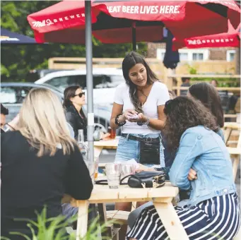  ?? JUSTIN TANG/ THE CANADIAN PRESS ?? With indoor dining ordered to close to fight the COVID surge, the restaurant industry warns that 33,000 workers will lose their jobs in Toronto, 12,000 in Ottawa and 14,900 in Peel Region.