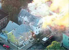  ?? THE ASSOCIATED PRESS ?? Emergency crews are responding to what they believe is a series of gas explosions that have damaged homes across three communitie­s north of Boston.