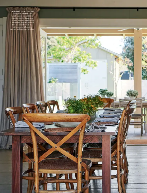  ??  ?? THESE PAGES The kitchen and living hub is where the family spend most of their time; the timber floors are painted Aalto Gargoyle with a low-sheen polyurethe­ne on top; the boatsheds in the distance provide extra storage and accommodat­ion.