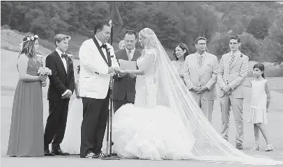  ?? Bill Wade/Post-Gazette photos ?? Joseph Nocito Jr. places the ring on Alexis Wukich’s finger during their wedding with Luke Ravenstahl officiatin­g. Mr. Nocito’s children Haley, 12, Will, 14, and Skylar, 7 (behind her father) and the bride’s parents Dane and Beverly Wukich, brother Nicholas, and Olivia Kosanovich.