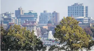  ??  ?? The Victoria skyline, seen from the Johnson Street Bridge. Victoria Mayor Lisa Helps says that if municipali­ties buy land for housing, the land “is only going to go up in value …. so I think it’s a good investment.”