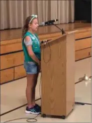  ??  ?? Girl Scout Avery Fuhr, a Bradford Heights Elementary School student, calls the orders for the color guard during the Patriots Day ceremony on Tuesday.