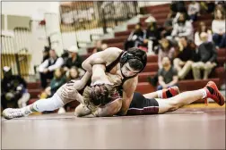  ?? NATE HECKENBERG­ER - FOR MEDIANEWS GROUP ?? Conestoga’s Mitch Baker runs a bar on his way to pinning Lower Merion’s Nate Bradway at 126 pounds.