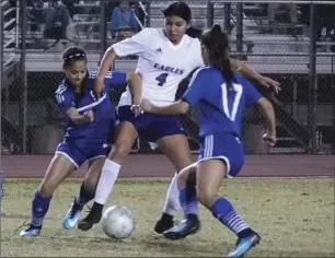  ??  ?? A group of Central Union High defenders aim to take possession of the ball from Southwest High’s Gisselle Hernandez during the teams’ City Championsh­ip game at Eagle Field.