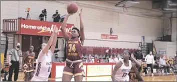  ??  ?? AWC’S CHRISTEINA BRYAN attempts a two-point shot over an Eastern Arizona defender.