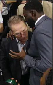  ?? GREGORY SHAMUS — GETTY IMAGES ?? Draymond Green of the Golden State Warriors talks with his former head coach Tom Izzo of the Michigan State Spartans after his college jersey retirement.