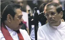  ??  ?? Mahinda Rajapaksa, left, alongside the Sri Lankan president Maithripal­a Sirisena