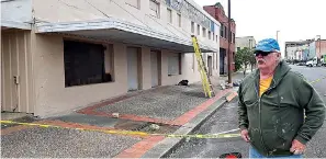  ?? Staff photo by Junius Stone ?? ■ Tom Morrissey, owner of the Union Supply building on Broad Street, recently began a project to refurbish the building’s exterior. He will get help from Main Street Texarkana to do so.