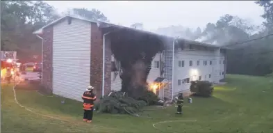  ?? Water Witch Hose Co. #2 of New Milford photo ?? Four units in the Harrybrook­e Park condo complex in Lanesville were damaged by a fire Tuesday morning. New Milford Mayor Pete Bass said no one was injured in the blaze. that broke around 4:30 a.m.