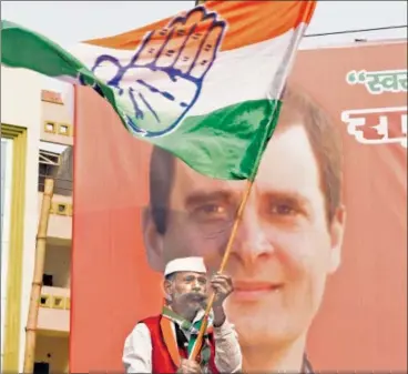  ?? SUBHANKAR CHAKRABORT­Y/HT ?? ▪ A Congress supporter celebrates in Lucknow on Tuesday