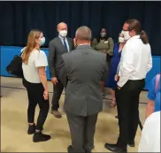  ?? DAN SOKIL — MEDIANEWS GROUP ?? Gov. Tom Wolf, center, speaks to Norristown Area School District staff and school board members after a press conference at Hancock Elementary School in Norristown on Wednesday.