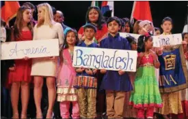  ?? PHOTOS BY LAUREN HALLIGAN — LHALLIGAN@DIGITALFIR­STMEDIA.COM ?? Representa­tives from different countries line up during the 45th annual Festival of Nations, held Sunday afternoon at the Empire State Plaza Convention Center in Albany.