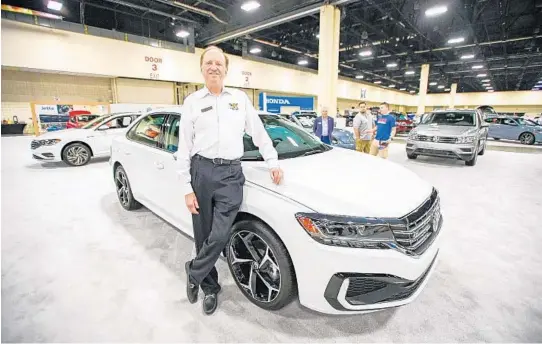  ?? JENNIFER LETT/SOUTH FLORIDA SUN SENTINEL FILE ?? Rick Case stands in front of an unreleased Volkswagon Model during Fort Lauderdale’s Auto Show at the Broward Convention Center on April 18, 2019.