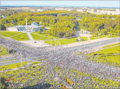  ?? Th e Associated P ress ?? People gather Saturday at a World War II monument to protest the official presidenti­al election results in Minsk, Belarus.