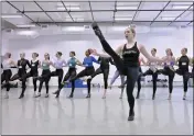  ?? JOSH REYNOLDS - THE ASSOCIATED PRESS ?? Amarisa LeBar, front, a Radio City Rockette, leads students in a Rockettes Precision Dance Technique course Wednesday, at the Boston Conservato­ry at Berklee in Boston. LeBar, 25, of Iselin, N.J., started teaching at her mother’s dance studio at 16, but finds sharing the Rockettes’ style with college students definitely more intense.