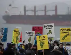  ?? JONATHAN HAYWARD/THE CANADIAN PRESS FILE PHOTO ?? Protesters gather outside Northern Gateway hearings in Prince Rupert, B.C. in 2012. The province has a history of environmen­tally based trench wars.