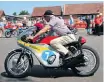  ??  ?? Allen Millyard on his replica of Mike Hailwood’s 1966 Honda six-cylinder that he built from scratch.