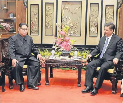  ?? Picture: AP. ?? North Korean leader Kim Jong Un, left, and Chinese counterpar­t Xi Jinping.