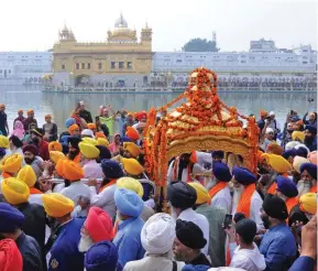  ?? Photo: AFP ?? Large numbers of devotees, including women, took part in the religious rituals.