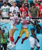  ?? Bob Self / Floridatim­es-union ?? San Francisco 49ers quarterbac­k Jimmy Garoppolo (10) and tight end George Kittle (85) celebrate in the end zone after a third quarter pass play for a touchdown. The Jacksonvil­le Jaguars hosted the San Francisco 49ers Nov. 21 TTIAA Bank Field in Jacksonvil­le, Florida.