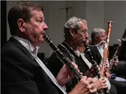  ??  ?? From top: SWFL Symphony’s oboe and flute section; composer and conductor Steve Hackman in action, and the symphony’s clarinet section