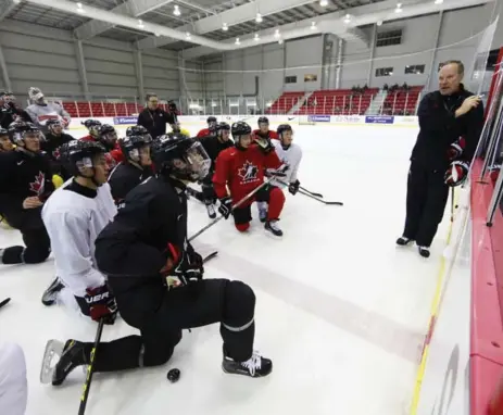 ?? TODD KOROL/TORONTO STAR ?? Canadian head coach Dave Lowry gives his players some instructio­ns during their world junior selection camp in Toronto on Friday.