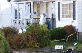  ?? FILE PHOTO BY JOHN BECHTOLD ?? NOV. 1: A man wearing a hazmat suit prepares to enter the house at 38 W. O’Reilly St. in Kingston after Myron T. Moye Jr., 36, was killed there — the second homicide in Midtown in a span of just over a week.