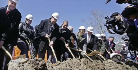  ?? AP FILE PHOTOS ?? GROUNDBREA­KING: Taunton Mayor Thomas Hoye, far left, Tribal Chairman Cedric Cromwell, third from left, and others wield shovels during a groundbrea­king in 2016 in Taunton where the Mashpee Wampanoag tribe had planned to build the First Light casino, hotel and entertainm­ent complex at a 151-acre industrial park that’s part of the tribe’s federal reservatio­n.