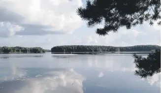  ??  ?? PEACE AND TRANQUILIT­Y: At Lake Joutsijrvi, try your hand at church boat rowing.