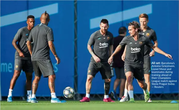  ?? — Reuters ?? All set: Barcelona’s Antoine Griezmann, Lionel Messi and teammates during training ahead of their Champions League match against Slavia Prague today.
