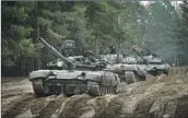 ?? Aleksandr Shulman Associated Press ?? GERMANY has agreed to send Leopard tanks to Ukraine. Above, captured Russian tanks in Ukraine.