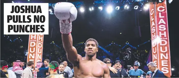  ??  ?? Anthony Joshua celebrates victory over Andy Ruiz Jr during the IBF, WBA, WBO & IBO heavyweigh­t title fight. Picture: Richard Heathcote/Getty Images