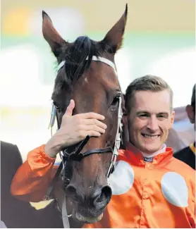  ?? PHOTO: GETTY IMAGES ?? Drinks all round . . . Jockey Blake Shinn hugs Who Shot Thebarman after the pair won the Sydney Cup at Randwick on Saturday.